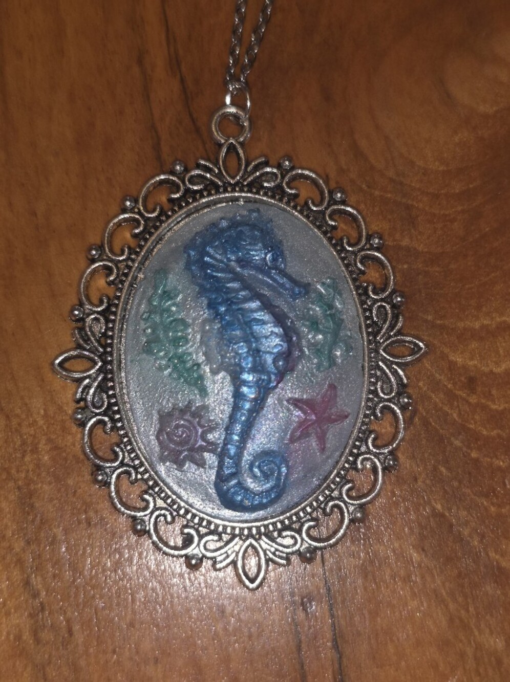 Blue Resin Sea Horse Brooch In Silver Metal Frame